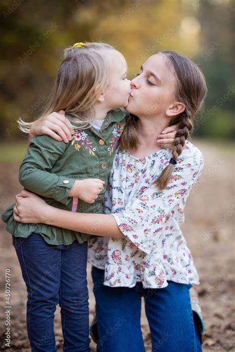 twins sisters kiss